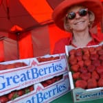 Women with boxes of strawberries