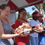 Women with big strawberry shortcake bowls